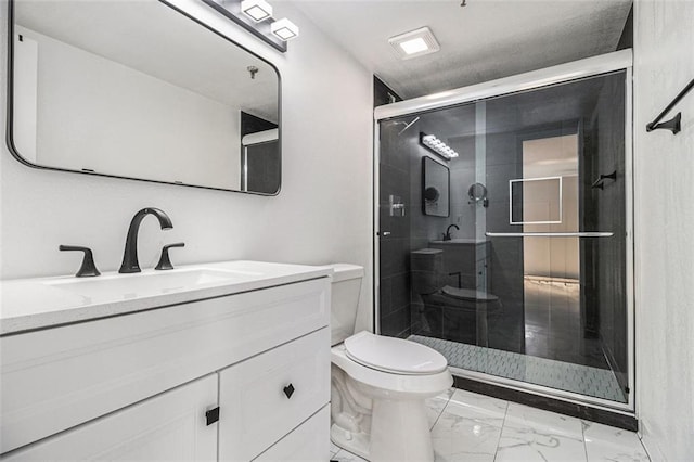 full bathroom featuring vanity, toilet, marble finish floor, and a shower stall