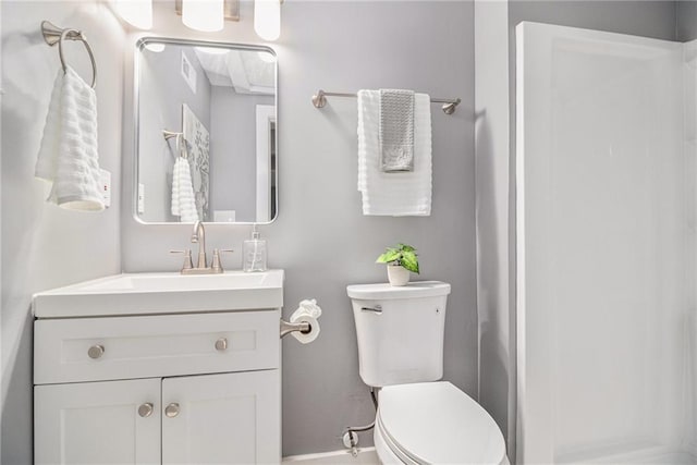 bathroom with toilet, baseboards, visible vents, and vanity