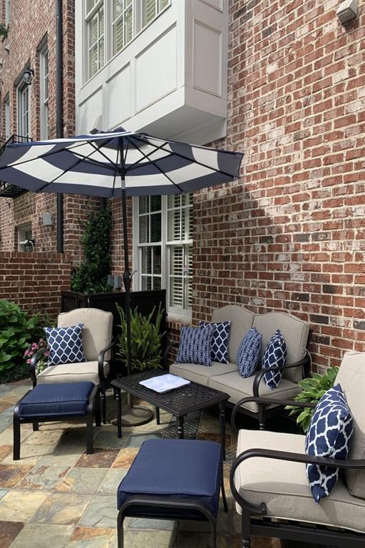 3707 Peachtree Rd NE Unit 8, Atlanta, GA 30319 - view of property featuring a garage and asphalt driveway