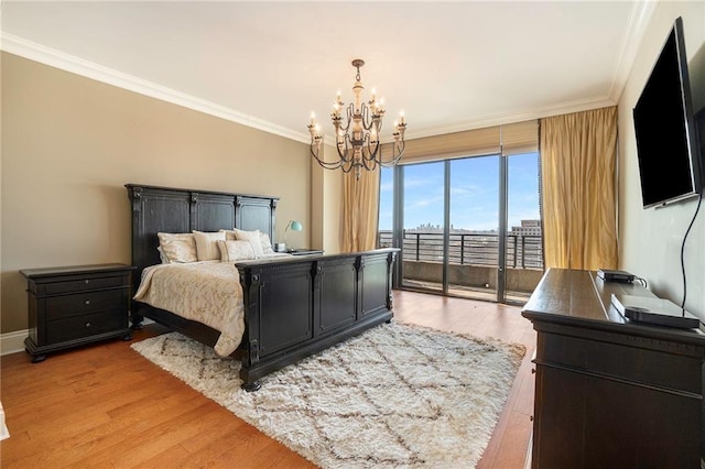 bedroom featuring access to outside, a notable chandelier, crown molding, and light hardwood / wood-style floors