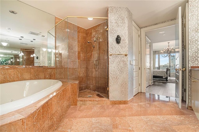 bathroom with tile patterned floors, separate shower and tub, and a notable chandelier