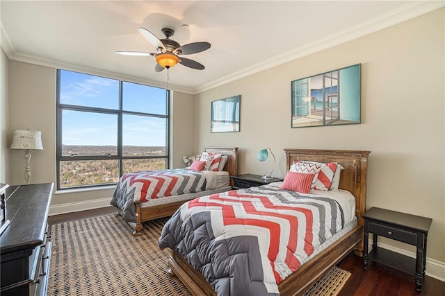 bedroom featuring ceiling fan, crown molding, and dark hardwood / wood-style floors