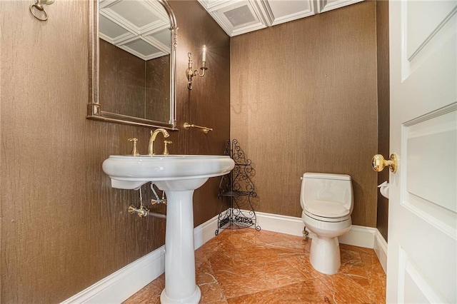 bathroom with toilet and ornate columns