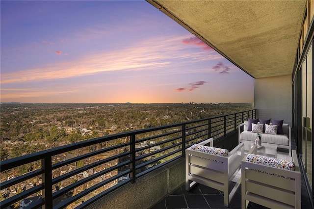 balcony at dusk with outdoor lounge area