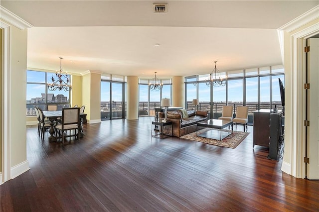 living room featuring a wall of windows, dark hardwood / wood-style flooring, a wealth of natural light, and ornamental molding