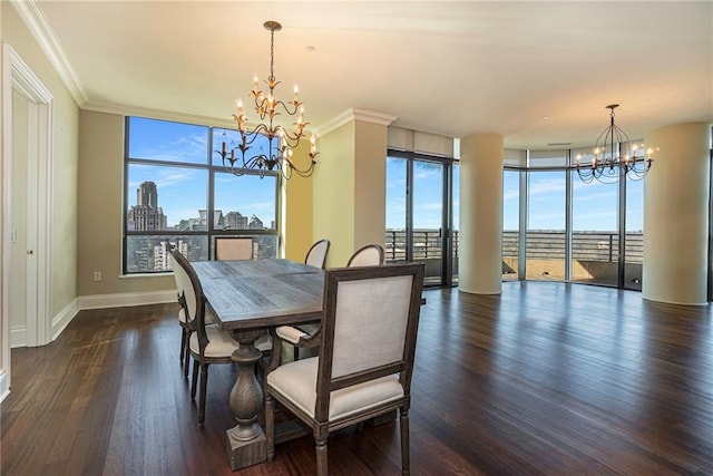 dining area featuring a wealth of natural light, an inviting chandelier, and ornamental molding