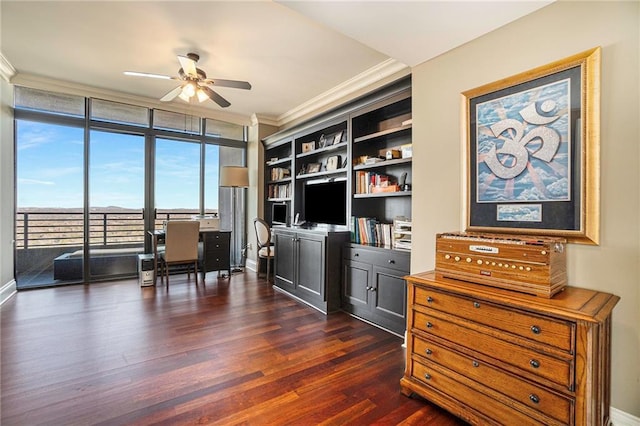 home office featuring ceiling fan, dark hardwood / wood-style floors, crown molding, expansive windows, and built in shelves