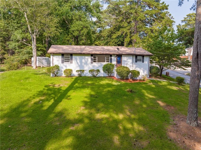 view of front of house with a front lawn