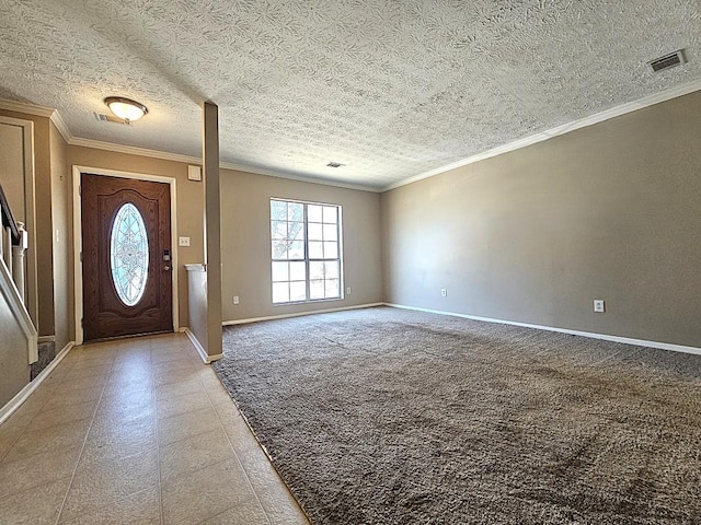 entrance foyer featuring crown molding, light colored carpet, and a textured ceiling