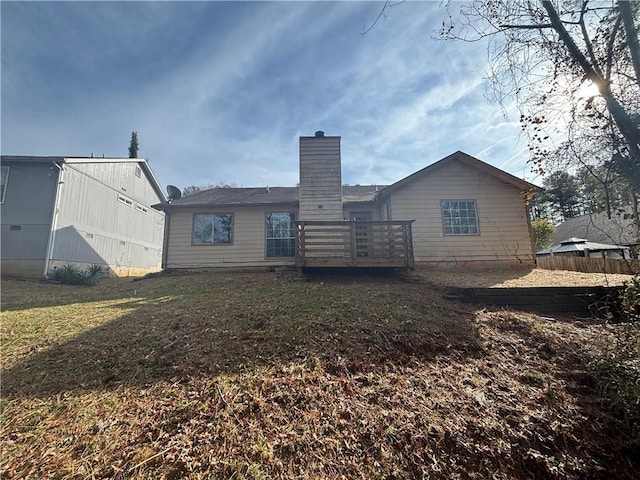 rear view of property featuring a yard