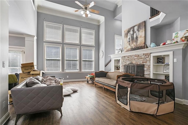 5410 Cottage Farm Rd, Alpharetta, GA 30022 - living area with wood finished floors, ornamental molding, a ceiling fan, a high ceiling, and a fireplace