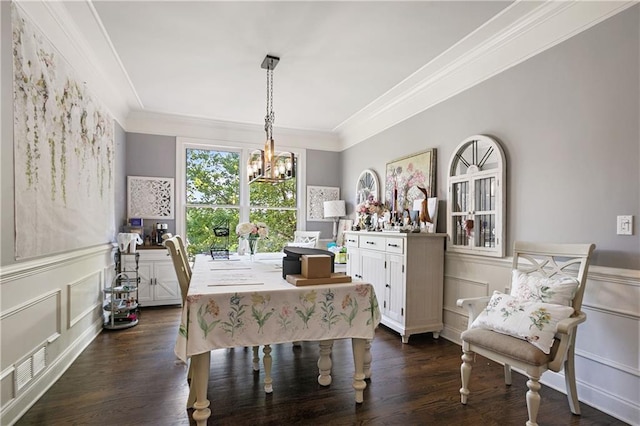 5410 Cottage Farm Rd, Alpharetta, GA 30022 - dining space with a decorative wall, crown molding, dark wood finished floors, a wainscoted wall, and a chandelier