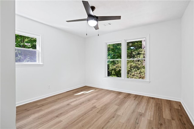 unfurnished room featuring ceiling fan and light hardwood / wood-style floors