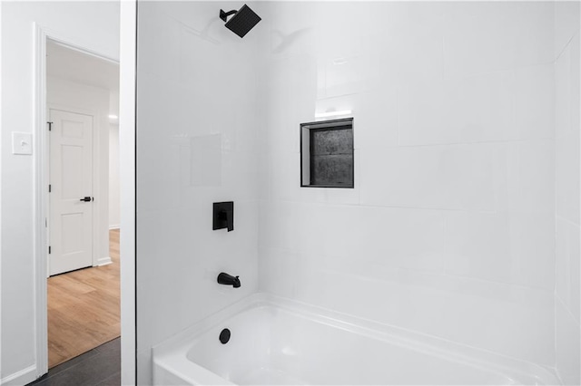 bathroom featuring hardwood / wood-style floors and shower / bath combination