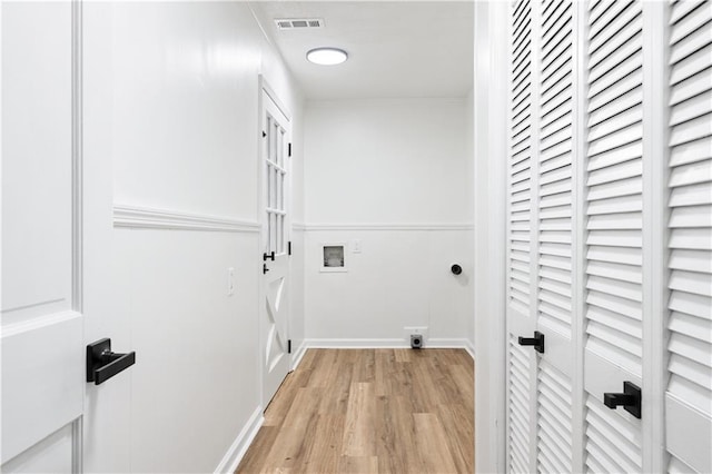 laundry room featuring washer hookup, hookup for an electric dryer, and light wood-type flooring