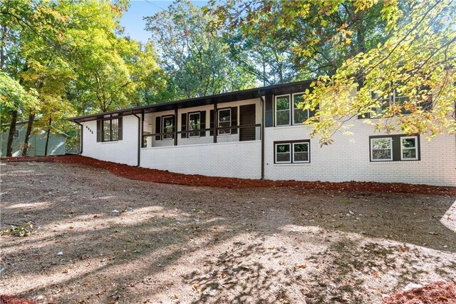 ranch-style house featuring a carport