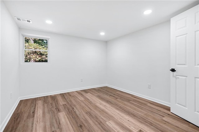 spare room with light hardwood / wood-style floors