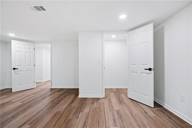 spare room with light wood-type flooring