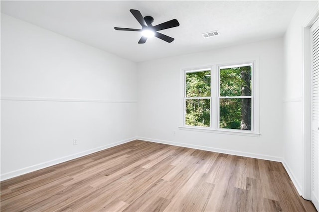 spare room with light hardwood / wood-style flooring and ceiling fan