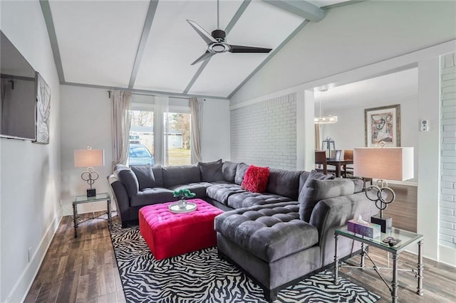 living room featuring hardwood / wood-style flooring, ceiling fan with notable chandelier, and vaulted ceiling with beams