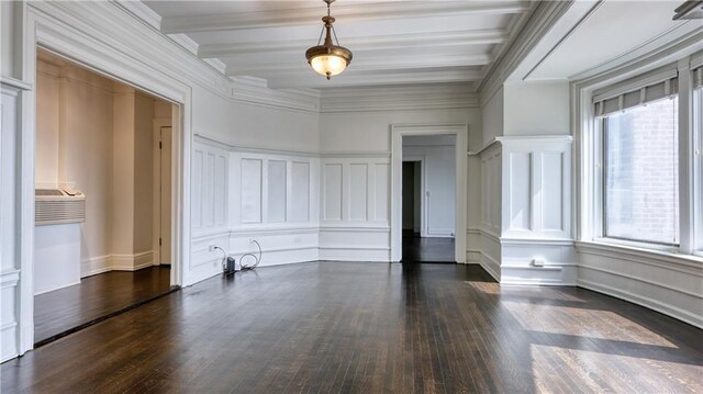 unfurnished room featuring beamed ceiling, dark hardwood / wood-style floors, crown molding, and a wealth of natural light