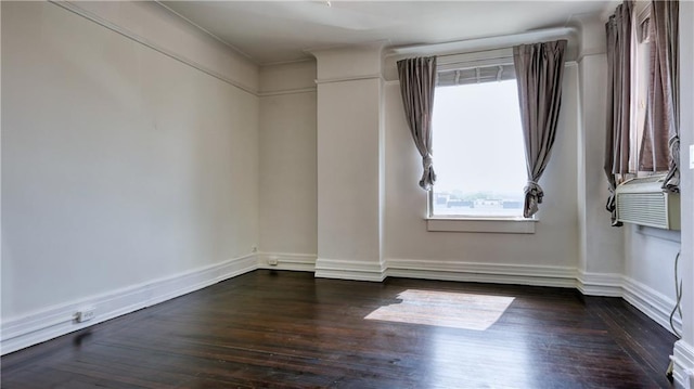 unfurnished room featuring dark wood-type flooring