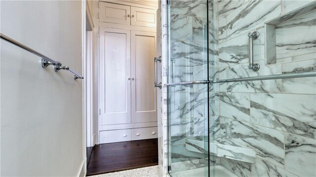 bathroom with wood-type flooring