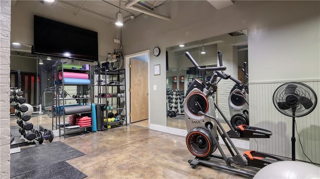 workout room featuring concrete floors