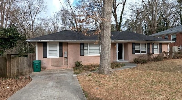 ranch-style house with fence and crawl space