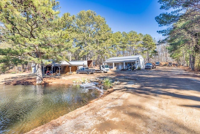 rear view of property featuring a water view