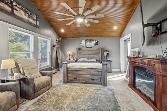 carpeted bedroom featuring vaulted ceiling, wooden ceiling, and ceiling fan