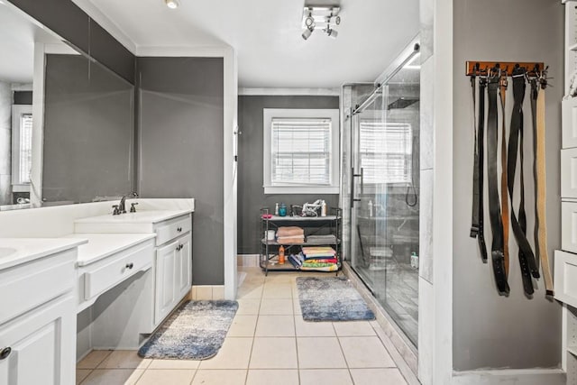 bathroom with vanity, an enclosed shower, and tile patterned flooring