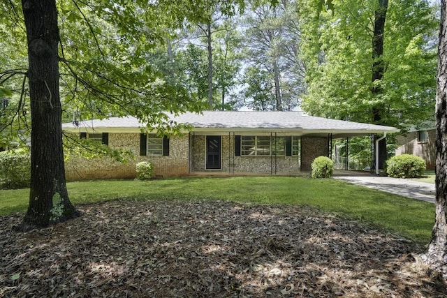 4400 Hickory Wood Ln, Atlanta, GA 30360 - ranch-style house with a front lawn, concrete driveway, an attached carport, brick siding, and a shingled roof