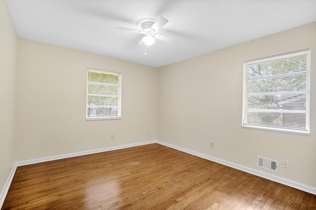 4400 Hickory Wood Ln, Atlanta, GA 30360 - spare room featuring wood finished floors, baseboards, and a ceiling fan