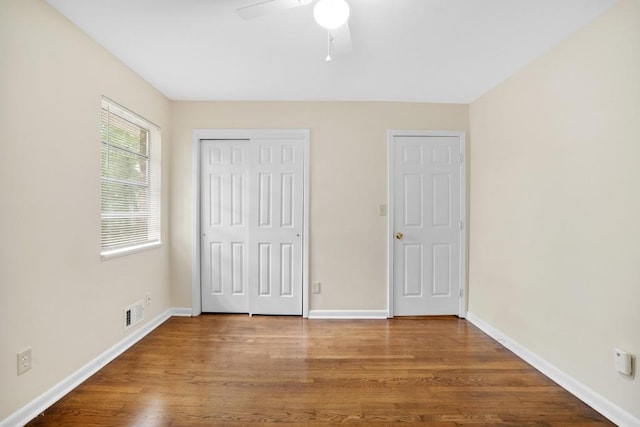 4400 Hickory Wood Ln, Atlanta, GA 30360 - unfurnished bedroom featuring wood finished floors, baseboards, a closet, and ceiling fan