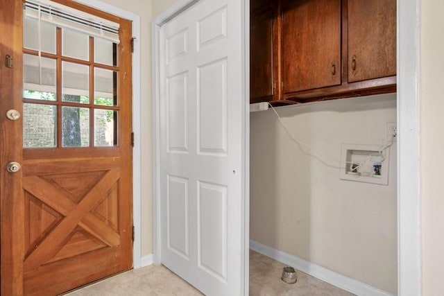 4400 Hickory Wood Ln, Atlanta, GA 30360 - laundry area featuring cabinet space, washer hookup, and baseboards