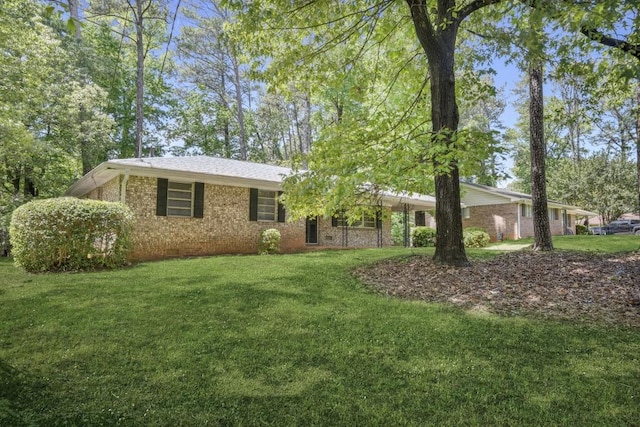 4400 Hickory Wood Ln, Atlanta, GA 30360 - ranch-style house with a front yard and brick siding