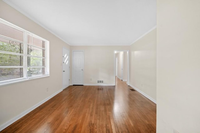 4400 Hickory Wood Ln, Atlanta, GA 30360 - empty room with wood finished floors, crown molding, and baseboards