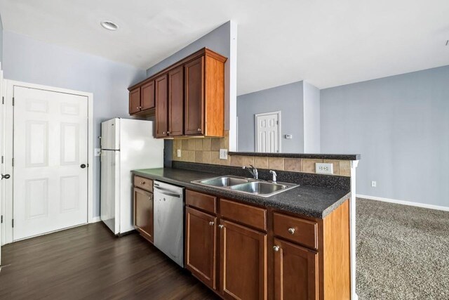 2872 Cross Creek Ct, Cumming, GA 30040 - kitchen featuring stainless steel dishwasher, dark countertops, a sink, and freestanding refrigerator