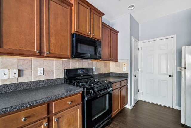 2872 Cross Creek Ct, Cumming, GA 30040 - kitchen featuring black appliances, dark wood-style flooring, dark countertops, and tasteful backsplash