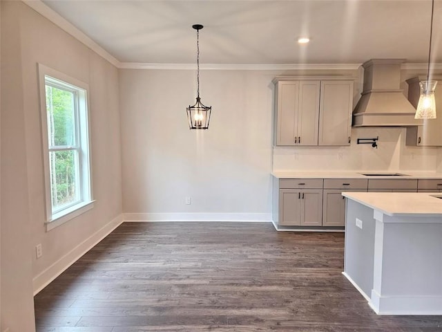 195 Silvercrest Dr, Acworth, GA 30101 - kitchen featuring custom exhaust hood, light countertops, dark wood-type flooring, crown molding, and gray cabinets