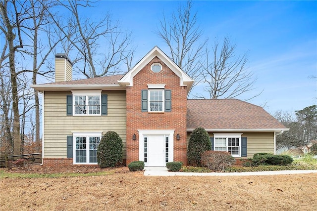 front facade with a front lawn