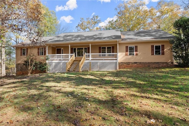 exterior space featuring a porch and a lawn