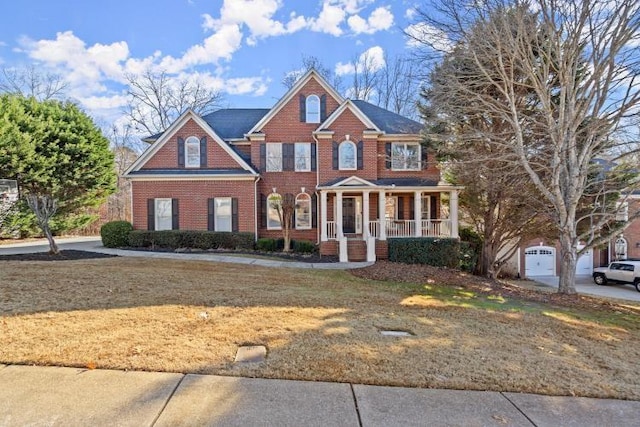 view of front facade featuring covered porch and a front lawn