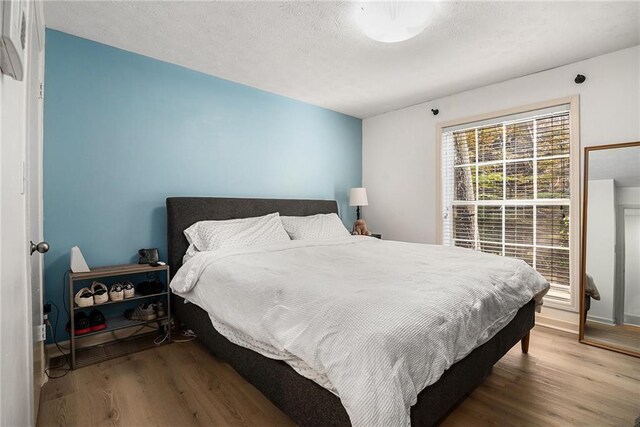 bedroom featuring wood-type flooring