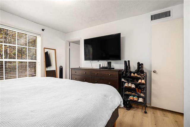 bedroom featuring light hardwood / wood-style flooring