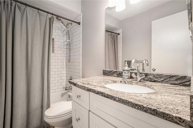 full bathroom featuring vanity, toilet, and shower / bath combo