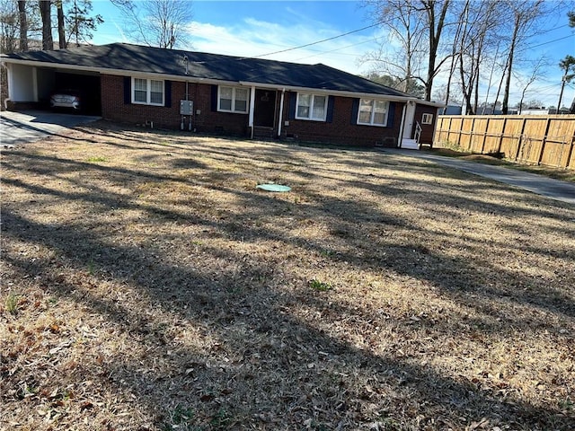 single story home featuring crawl space, brick siding, fence, and driveway