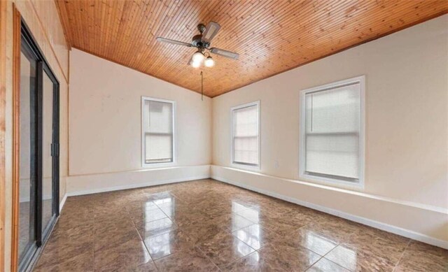 spare room featuring a ceiling fan, wooden ceiling, baseboards, crown molding, and vaulted ceiling