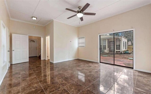 empty room featuring ornamental molding, baseboards, and ceiling fan